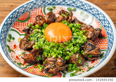 Grilled chicken thigh with sweet and savory sauce and egg. Grilled chicken thigh with sweet and savory sauce and egg. 142695340