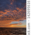 The rising sun breathes life into the heavens and the earth with its divine light. 142695616