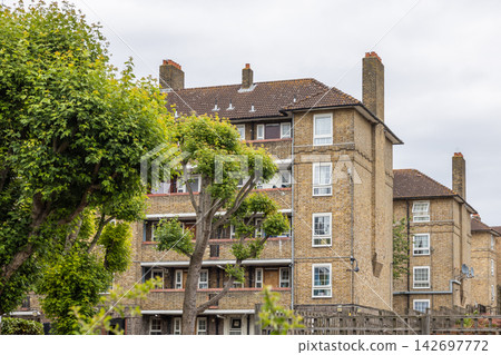 Traditional yellow brick council housing block Traditional yellow brick council housing block 142697772