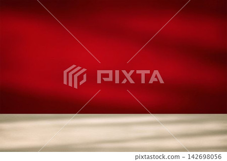 Empty red studio background with light and shadow on a table surface. 142698056