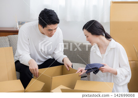 A couple preparing to move A couple preparing to move 142699008