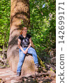 Travel Woman happy in a park spring near water 142699171