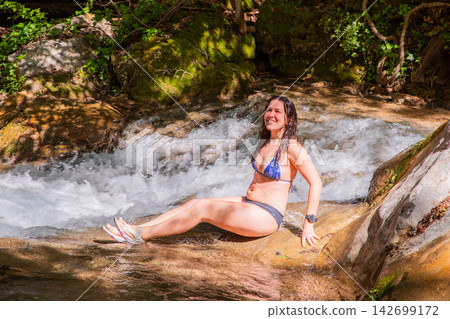 Travel Woman happy in a park spring near water 142699172