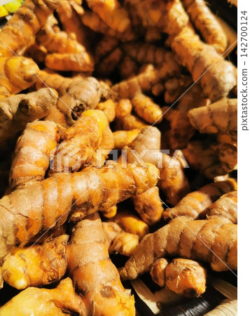 curcuma root background curcuma root background 142700124