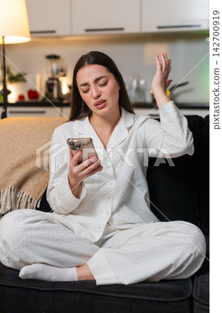Young woman scrolling smartphone sees loss in online game lottery jackpot reacts sad shakes head no Young woman scrolling smartphone sees loss in online game lottery jackpot reacts sad shakes head no 142700919