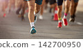 Marathon running in the light of evening 142700950