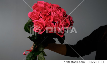 Bouquet of bright pink roses, flowers on a neutral background 142701111