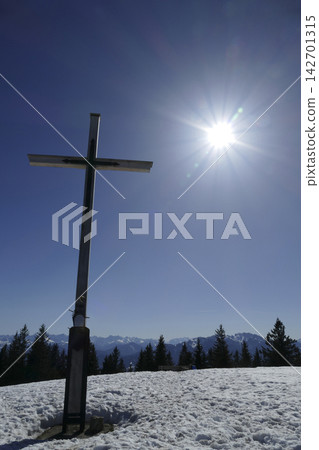Summmit cross of Rechelberg mountain in wintertime, Bavaria, Germany Summmit cross of Rechelberg mountain in wintertime, Bavaria, Germany 142701315