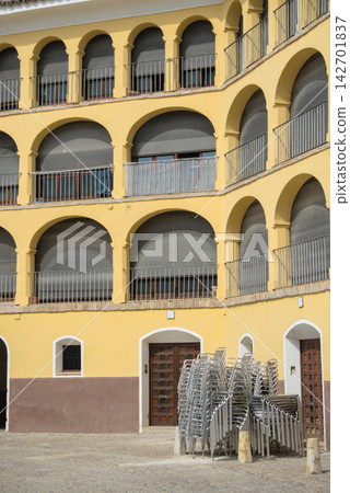 Stacked chairs on the ring of the old bullring of Tarazona, Aragon, Spain 142701837
