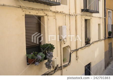 Potted succulents on a window ledge of an old house in Tarazona, Aragon Potted succulents on a window ledge of an old house in Tarazona, Aragon 142701863