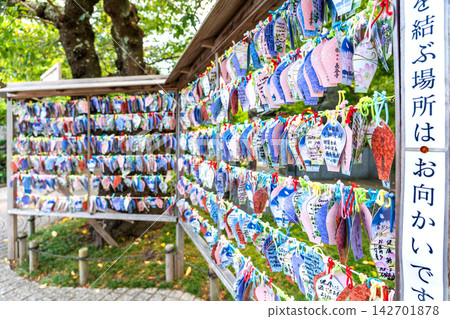 Colorful paper prayer plaques hanging at Hase-dera temple in Kamakura Japan Colorful paper prayer plaques hanging at Hase-dera temple in Kamakura Japan 142701878