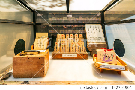 Traditional wooden prayer tablets and donation box at Hase-dera in Kamakura Japan Traditional wooden prayer tablets and donation box at Hase-dera in Kamakura Japan 142701904