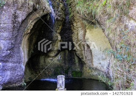 A view of a waterfall and pond at the entrance to the Oya History Museum in Utsunomiya City, Tochigi Prefecture. A view of a waterfall and pond at the entrance to the Oya History Museum in Utsunomiya City, Tochigi Prefecture. 142701928