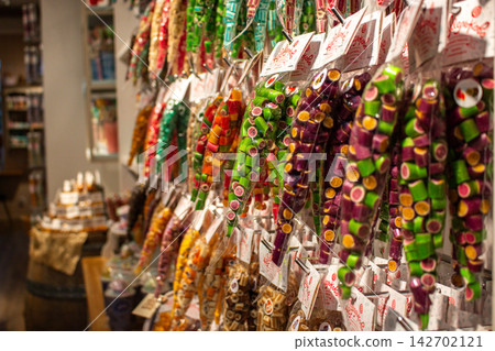 Kaliningrad, Russia - 23.07.26 - Candy store interior with colorful sweets. Vibrant treats for kids and adults. Local handmade business selling traditional confections. Eye catching bright candies Kaliningrad, Russia - 23.07.26 - Candy store interior with colorful sweets. Vibrant treats for kids and adults. Local handmade business selling traditional confections. Eye catching bright candies 142702121