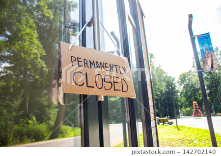 PERMANENTLY CLOSED notice on cafe entrance. Small business closes due to Financial struggles. High prices cause customer falling PERMANENTLY CLOSED notice on cafe entrance. Small business closes due to Financial struggles. High prices cause customer falling 142702140