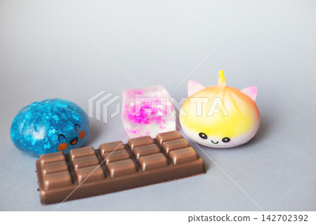 Colorful collection of stress relief squishy toys and chocolate Colorful collection of stress relief squishy toys and chocolate 142702392