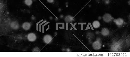 Black Background with Soft White Bokeh Lights and Abstract Glowing Effects Black Background with Soft White Bokeh Lights and Abstract Glowing Effects 142702451