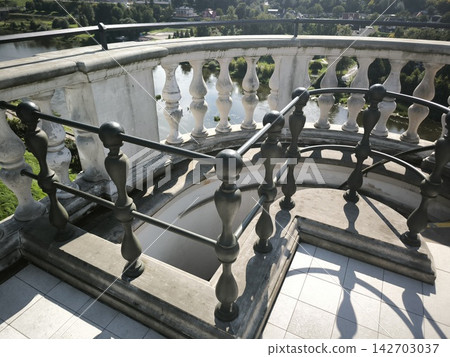 Stone balusters and metal railings on the observation deck Stone balusters and metal railings on the observation deck 142703037