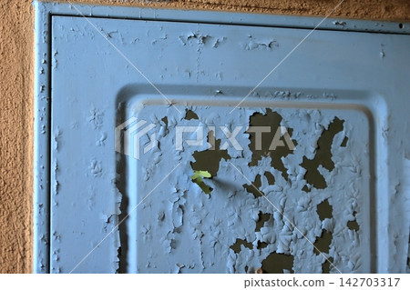 Image of peeling paint on a front door Image of peeling paint on a front door 142703317