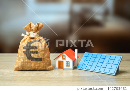 Euro money bag and a house with solar panels. Profit from home power generation. Green tariff. Subsidies and grants for the purchase of autonomous home systems. Euro money bag and a house with solar panels. Profit from home power generation. Green tariff. Subsidies and grants for the purchase of autonomous home systems. 142703481