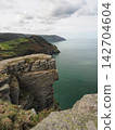 Sheer cliffs and coastal vista from Castle Rock, Valley of Rocks, Exmoor, Devon 142704604