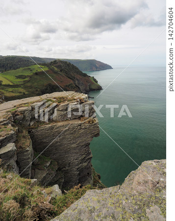 Sheer cliffs and coastal vista from Castle Rock, Valley of Rocks, Exmoor, Devon Sheer cliffs and coastal vista from Castle Rock, Valley of Rocks, Exmoor, Devon 142704604
