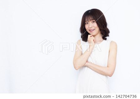 Woman thinking with a smile Woman thinking with a smile 142704736