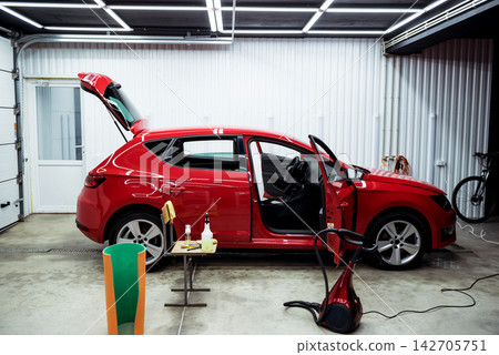 Disassembled car for deep dry cleaning of the interior. Disassembled car for deep dry cleaning of the interior. 142705751