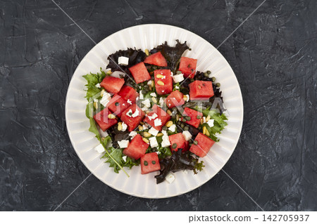Mediterranean Watermelon and Feta Salad with Capers and Pine Nuts Mediterranean Watermelon and Feta Salad with Capers and Pine Nuts 142705937