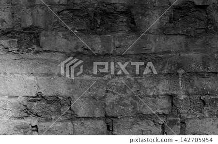 Soot and carbon black remains on a damaged brick wall after a fire accident. Burnt Bricks In A Wall After A Fire Accident Textured Stock Photo Soot and carbon black remains on a damaged brick wall after a fire accident. Burnt Bricks In A Wall After A Fire Accident Textured Stock Photo 142705954