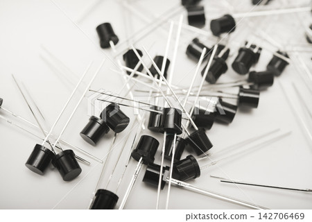 Black plastic photodiodes in packaging. Phototransistors. Semiconductor devices. Black plastic photodiodes in packaging. Phototransistors. Semiconductor devices. 142706469