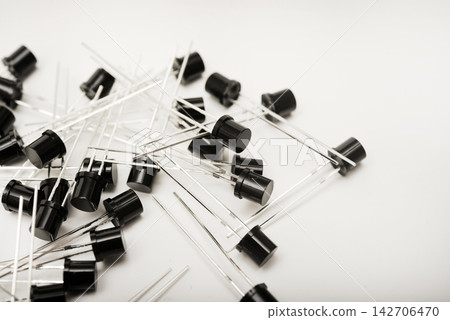 Black plastic photodiodes in packaging. Phototransistors. Semiconductor devices. Black plastic photodiodes in packaging. Phototransistors. Semiconductor devices. 142706470