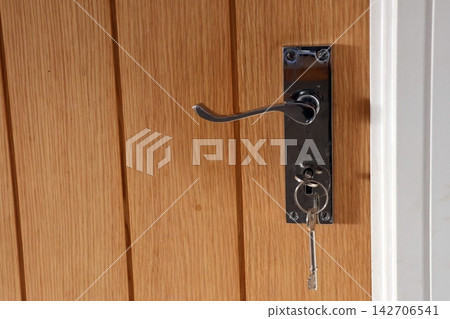 Wooden door with metal handle and key Wooden door with metal handle and key 142706541
