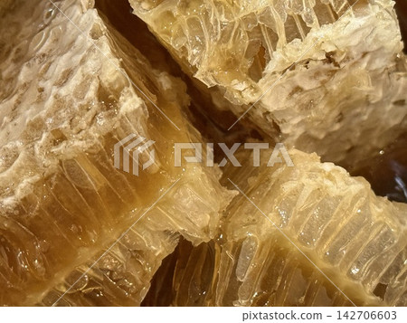 Natural Honeycomb Filled with Golden Honey Natural Honeycomb Filled with Golden Honey 142706603
