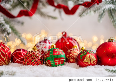 Red Christmas Ornaments with Gold Patterns on Snow Red Christmas Ornaments with Gold Patterns on Snow 142706613