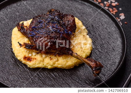 Duck leg confit roasted with salt and allspice. Duck leg confit Duck leg confit roasted with salt and allspice. Duck leg confit 142706910