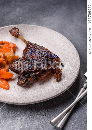 Duck leg confit roasted with salt and allspice. Duck leg confit Duck leg confit roasted with salt and allspice. Duck leg confit 142706922