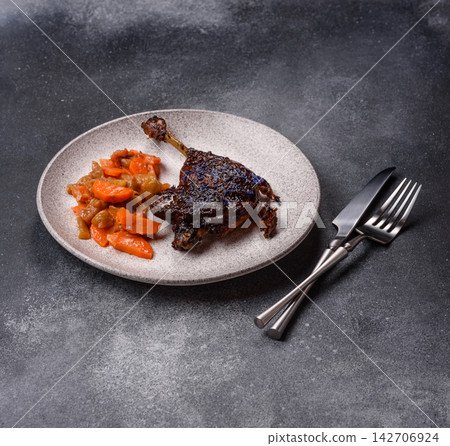 Duck leg confit roasted with salt and allspice. Duck leg confit 142706924