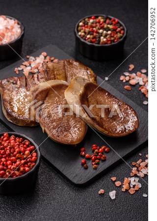 Slices of grilled pork or beef tongue seasoned with salt and allspice. Sliced beef tongue Slices of grilled pork or beef tongue seasoned with salt and allspice. Sliced beef tongue 142706952