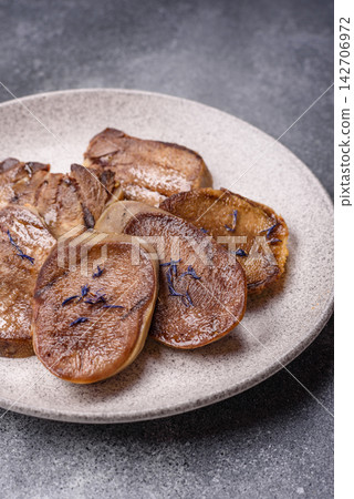 Slices of grilled pork or beef tongue seasoned with salt and allspice. Sliced beef tongue Slices of grilled pork or beef tongue seasoned with salt and allspice. Sliced beef tongue 142706972