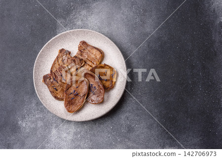 Slices of grilled pork or beef tongue seasoned with salt and allspice. Sliced beef tongue Slices of grilled pork or beef tongue seasoned with salt and allspice. Sliced beef tongue 142706973