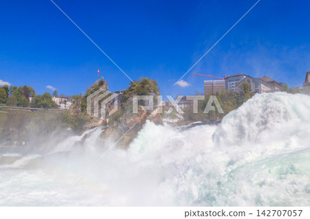 View of Rhine Falls in Schaffhausen canton, Switzerland. Most powerful waterfall in Europe View of Rhine Falls in Schaffhausen canton, Switzerland. Most powerful waterfall in Europe 142707057
