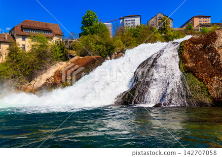View of Rhine Falls in Schaffhausen canton, Switzerland. Most powerful waterfall in Europe View of Rhine Falls in Schaffhausen canton, Switzerland. Most powerful waterfall in Europe 142707058
