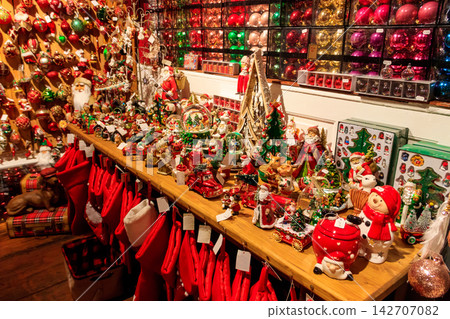 Christmas and New Year's toys in a store. Festive winter Christmas trade Christmas and New Year's toys in a store. Festive winter Christmas trade 142707082