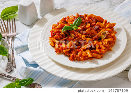 Penne pasta with sausage, mushrooms, tomato sauce Penne pasta with sausage, mushrooms, tomato sauce 142707109