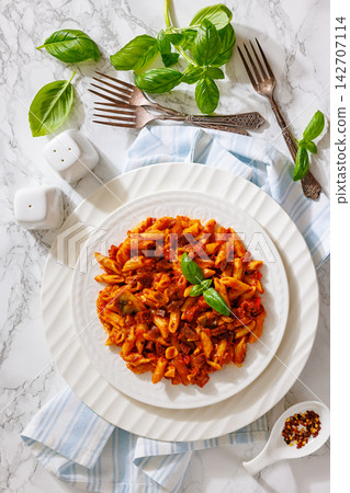 Penne pasta with sausage, mushrooms, tomato sauce 142707114
