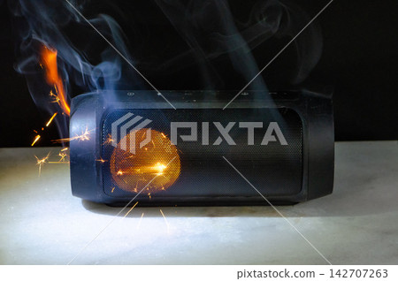 Portable Bluetooth speaker burning inside driver with sparks as overheating and fire danger Portable Bluetooth speaker burning inside driver with sparks as overheating and fire danger 142707263