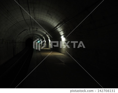 Cars driving through a tunnel Cars driving through a tunnel 142708131