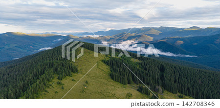 Aerial view of Kukul mountain area in Carpathians, Ukraine at sunset Aerial view of Kukul mountain area in Carpathians, Ukraine at sunset 142708346