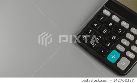 Calculator is used for tasks related to finance and accounting Calculator is used for tasks related to finance and accounting 142708357